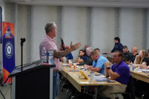 Lance Bachmann presenting to Winners Circle members during an indoor business training session.