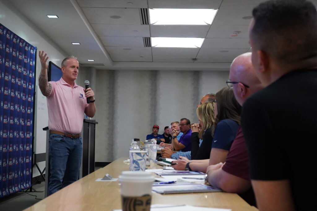 Lance Bachmann presenting to Winners Circle attendees during an indoor business training session.